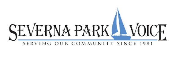 coffee shop owner standing in doorway